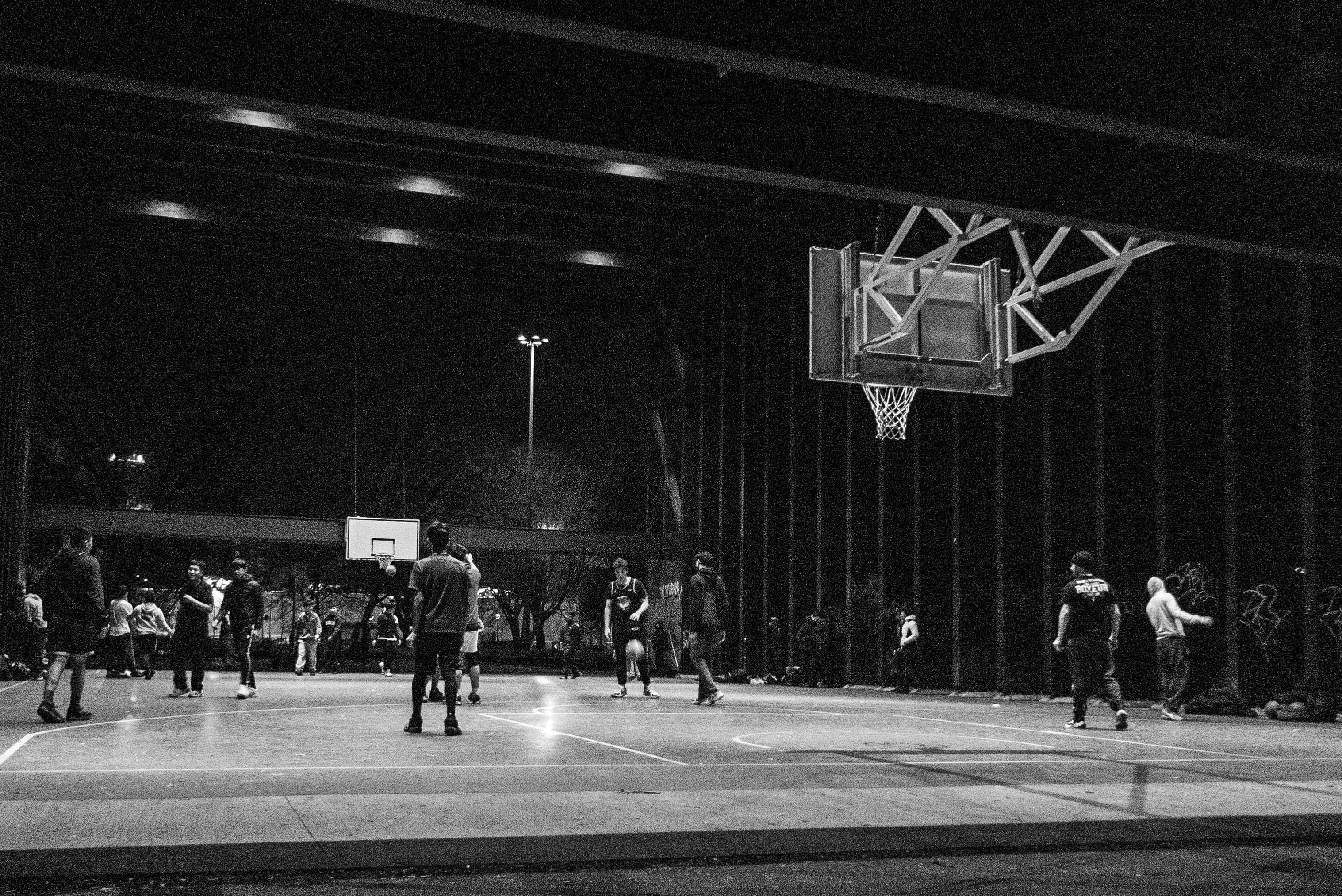 people playing basketball outside